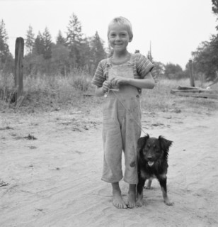 Migrant boy, family, live in grower's camp for..., near Grants pass, Josephine County, Oregon, 1939. Creator: Dorothea Lange.