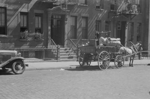 A tenant is moving on horse-drawn wagon, 61st Street between 1st and 3rd Avenues, New York, 1938. Creator: Walker Evans.