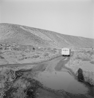 School bus starts up the flat 7:30 a.m. to collect..., Malheur County, Oregon, 1939. Creator: Dorothea Lange.