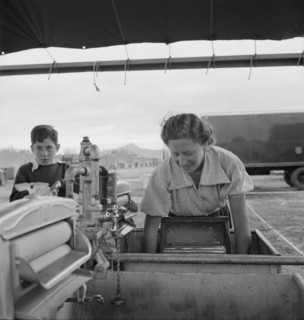 Portable laundry unit, shower unit beyond, FSA camp, Merrill, Oregon, 1939. Creator: Dorothea Lange.