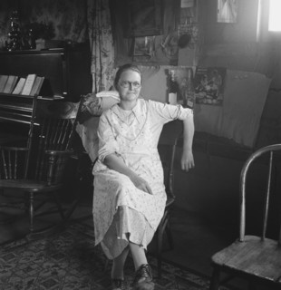 Mrs. Hull, in one room basement dugout home, late afternoon. Dead Ox Flat, Malheur County, Oregon.