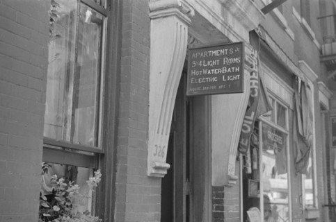 New York, New York. 61st Street between 1st and 3rd Avenues. A sign offering apartments for rent.