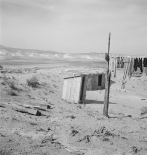 The Dazey place. Homedale district, Malheur County, Oregon. [Outside toilet and storm cellar].