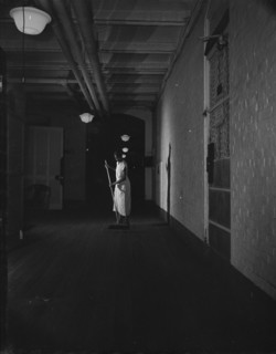 Washington, D.C. Government charwoman cleaning after regular working hours. [Mrs Ella Watson].