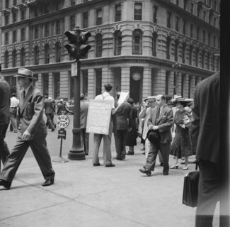 42nd Street and Madison Avenue. Street hawker selling Consumer's Bureau Guide. New York City.