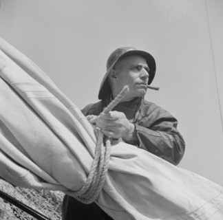 New York, New York. A New England fisherman preparing his boat to leave the New York docks.