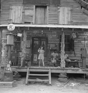 Daughter of white tobacco sharecropper at country store. Person County, North Carolina.