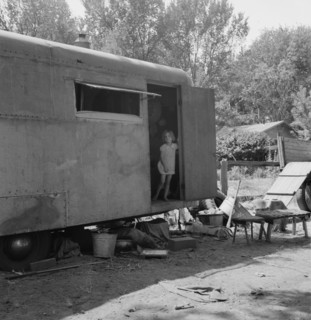 The house trailer and the youngest little girl. Washington, Yakima Valley, Toppenish.