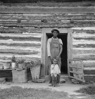 Young sharecropper and his first child. Hillside Farm. Person County, North Carolina.