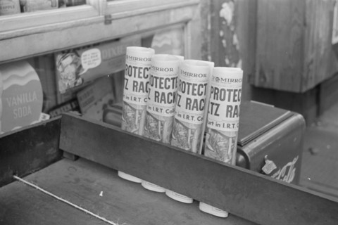 New York, New York. 61st Street between 1st and 3rd Avenues. Newspapers for sale.