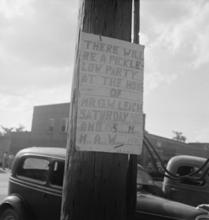 Sign tacked to pole near the post office. Main street, Pittsboro, North Carolina.