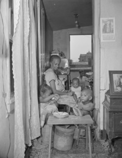 Washington, D.C. Mrs. Ella Watson, a government charwoman and her grandchildren.