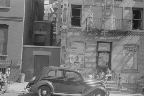 New York, New York. 61st Street between 1st and 3rd Avenues. House fronts.