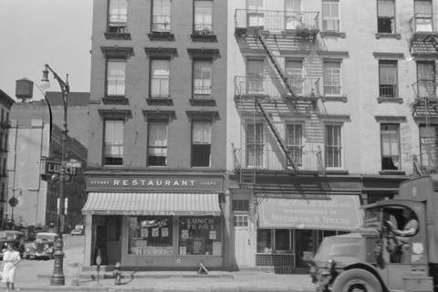 New York, New York. 61st Street between 1st and 3rd Avenues. House fronts.