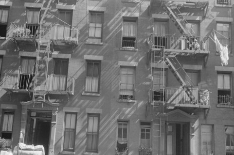 New York, New York. 61st Street between 1st and 3rd Avenues. House fronts.