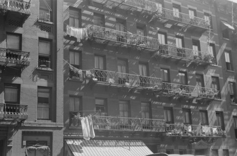New York, New York. 61st Street between 1st and 3rd Avenues. House fronts.