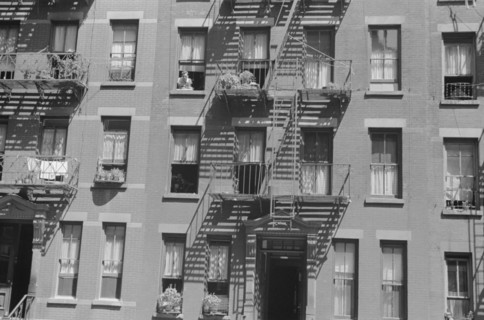 New York, New York. 61st Street between 1st and 3rd Avenues. House fronts.