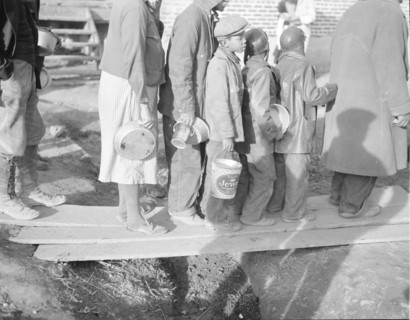 Negroes waiting for food in the Forrest City, Arkansas, refugee camp.