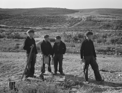Boys wait for school bus in the morning. Malheur County, Oregon.