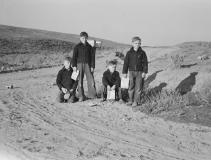 Boys wait for school bus in the morning. Malheur County, Oregon.