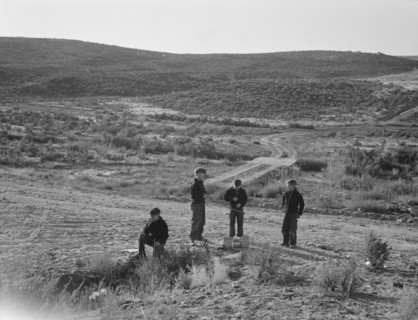 Boys wait for school bus in the morning. Malheur County, Oregon.