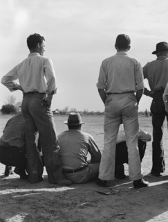Watching ball game. Shafter camp for migrants. California.