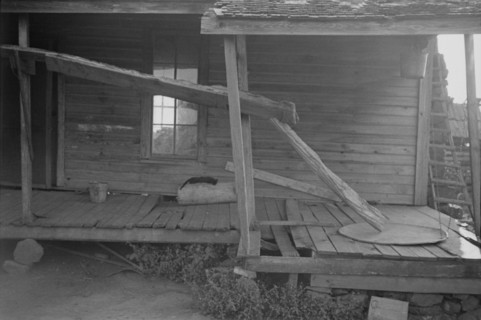 Porch of a sharecropper's cabin, Hale County, Alabama.