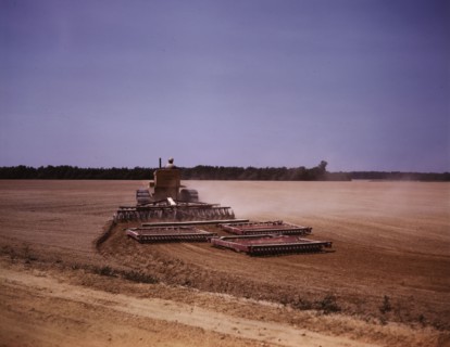 Harrowing a field with a diesel tractor, Seabrook Farm, Bridgeton, N.J., 1942. Creators: Marion Post Wolcott, John Collier.