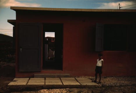 Child of an FSA - R.R. borrower? in front of their house, Puerto Rico, 1941 or 1942. Creator: Jack Delano.