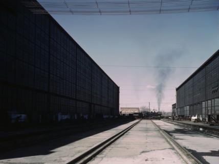 A completely overhauled engine on the transfer table at the Atchison, Topeka..., New Mexico., 1943. Creator: Jack Delano.