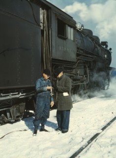 Railroad conductor George E. Burton and engineer J.W. Edwards...Chicago, Ill., 1943. Creator: Jack Delano.