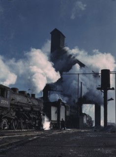 Locomotives over the ash pit at the roundhouse and coaling station...Chicago, Ill., 1942. Creator: Jack Delano.