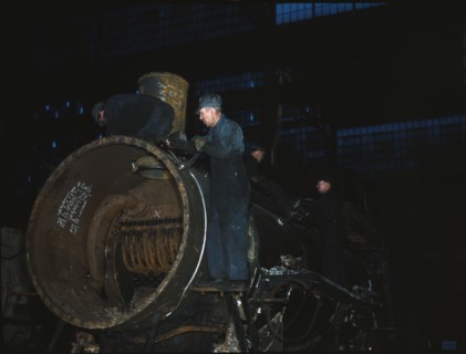 Working on the boiler of a locomotive at the 40th Street shops of the C & NW RR, Chicago, Ill., 1942 Creator: Jack Delano.
