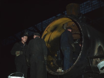 Working on the boiler of a locomotive at the 40th Street shops of the C & NW RR, Chicago, Ill., 1942 Creator: Jack Delano.