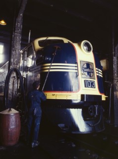 Washing one of the Santa Fe R.R. 54 hundred horse power diesel freight...,Argentine, Kansas, 1943. Creator: Jack Delano.