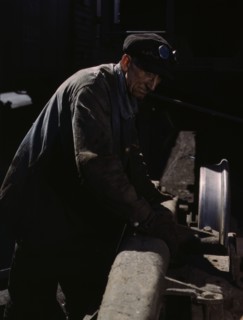 Sam Cell, working on the truck of a car..., C & NW RR's Proviso yard, Chicago, Ill., 1943. Creator: Jack Delano.