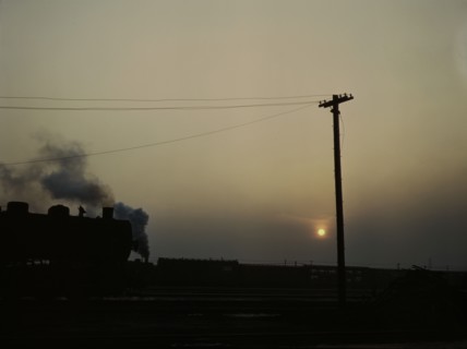 View in a departure yard at C & NW RR's Proviso (?) yard at twilight, Chicago, Ill., 1942. Creator: Jack Delano.