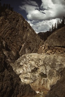 Million dollar highway [U.S. 550] is cut through massive rocks in Ouray County, Colorado, 1940. Creator: Russell Lee.