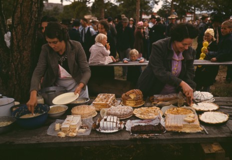 Cutting the pies and cakes at the barbeque dinner, Pie Town, New Mexico Fair, 1940. Creator: Russell Lee.