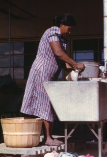 Woman at the community laundry on Saturday afternoon, FSA ... camp, Robstown, Tex., 1942. Creator: Arthur Rothstein.
