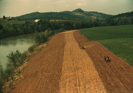 Planting corn along a river in northeastern Tennessee, 1940. Creator: Marion Post Wolcott.