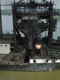 Loading coal into a lake freighter at the Pennsylvania Railroad docks, Sandusky, Ohio, 1943. Creator: Jack Delano.