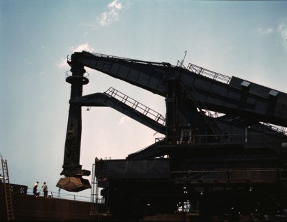 Pennsylvania R.R. ore docks, unloading iron ore from a lake freighter..., Cleveland, Ohio, 1943. Creator: Jack Delano.