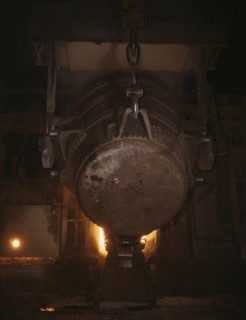 Ladle of molten iron is poured into..., Allegheny Ludlum Steele Corp., Brackenridge, Pa., (1941?). Creator: Alfred T Palmer.