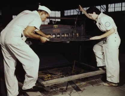 Learning to work a cutting machine, these two NYA employees...Corpus Christi, Texas, 1942. Creator: Howard Hollem.