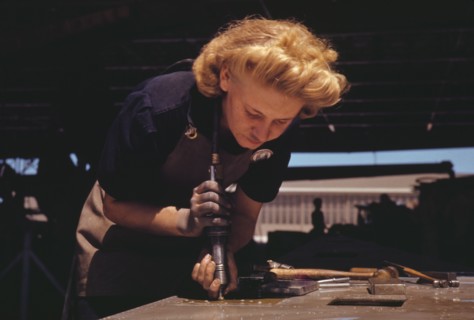 Working in the Assembly and Repair Dept. of the Naval Air Base, Corpus Christi, Texas, 1942. Creator: Howard Hollem.