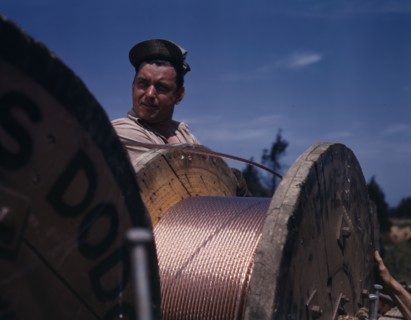 This husky member of a construction crew building a new 33,000-volt..., Fort Knox, Ky., 1942. Creator: Alfred T Palmer.