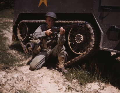 A young soldier of the armored forces holds and sights his Garand rifle like..., Fort Knox, Ky, 1942 Creator: Alfred T Palmer.