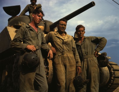 Tank crew standing in front of an M-4 tank, Ft. Knox, Ky., 1942. Creator: Alfred T Palmer.