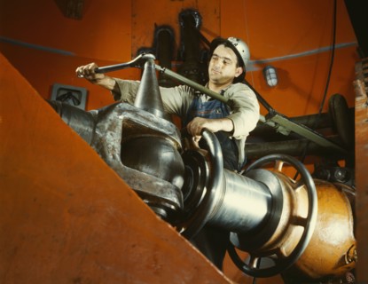 Tightening a nut on a guide vane operating seromotor in TVA's..., Watts Bar Dam, Tennessee, 1942. Creator: Alfred T Palmer.